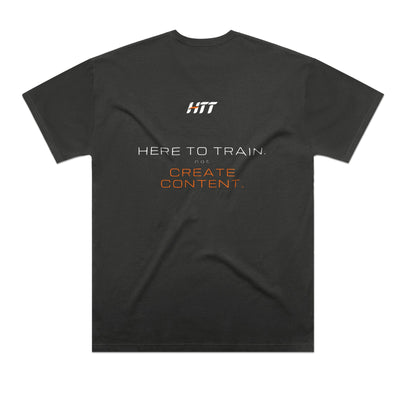 Back of a coal HTT oversized tee printed HERE TO TRAIN. NOT CREATE CONTENT.