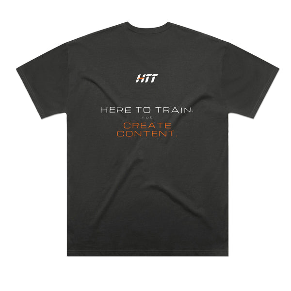 Back of a coal HTT oversized tee printed HERE TO TRAIN. NOT CREATE CONTENT.