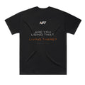 Back of a black HTT oversized tee printed ARE YOU USING THAT, OR LIVING THERE?