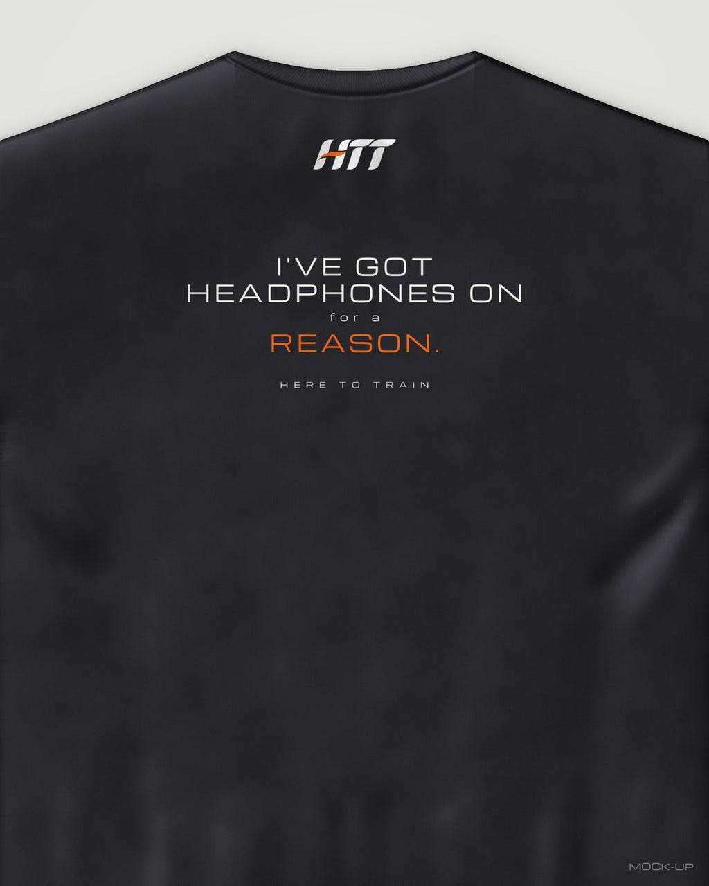 Back of a black HTT oversized tee printed I'VE GOT HEADPHONES ON FOR A REASON. (portrait crop)