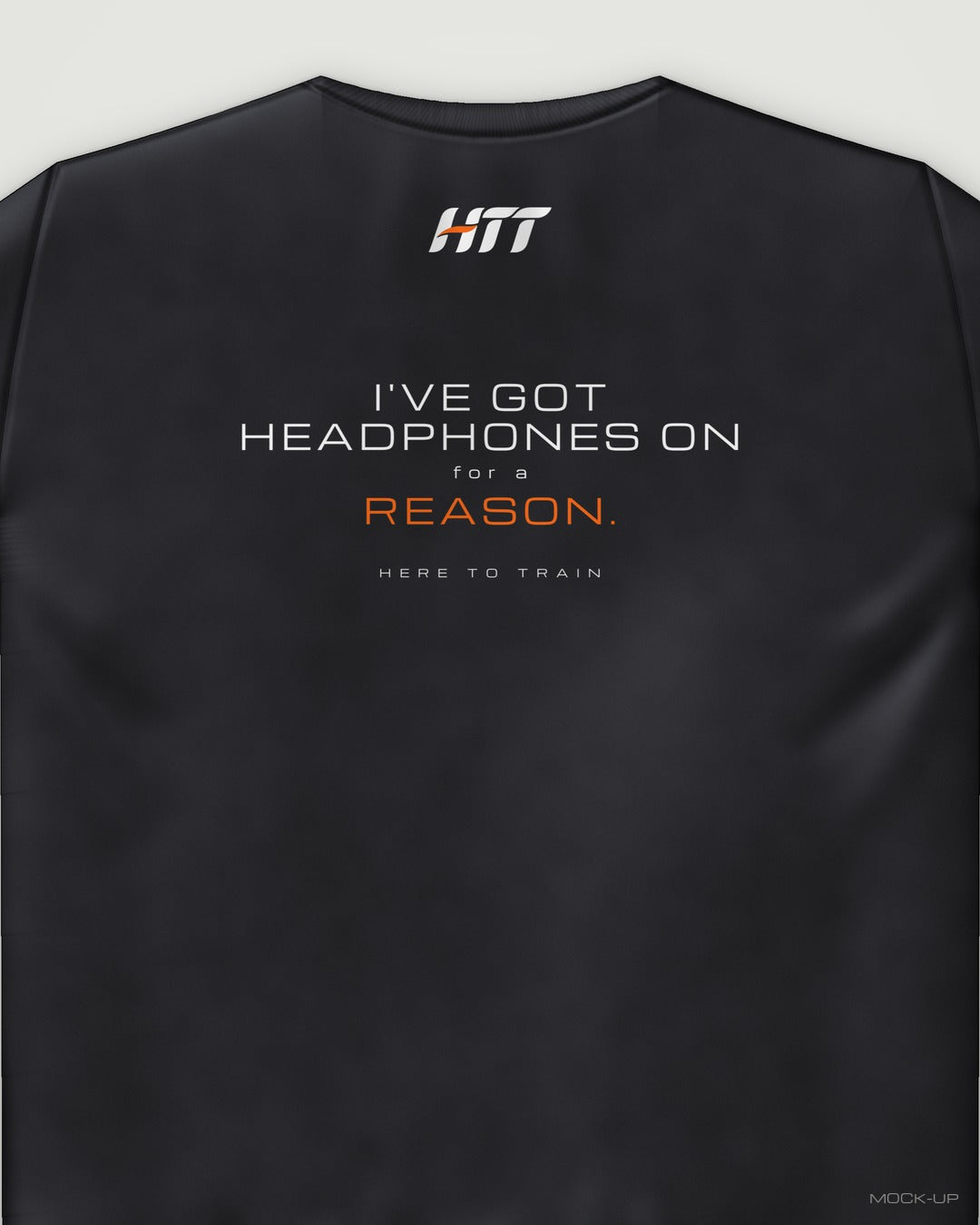 Back of a black HTT standard fit tee printed I'VE GOT HEADPHONES ON FOR A REASON. (portrait crop)