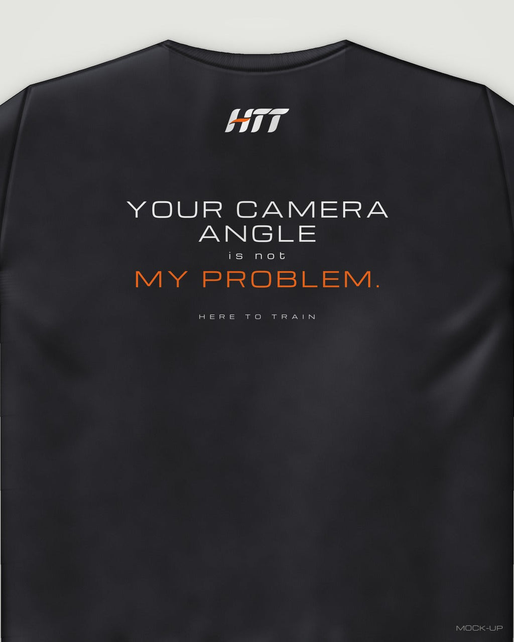 Back of a black HTT standard fit tee printed YOUR CAMERA ANGLE IS NOT MY PROBLEM. (portrait crop)