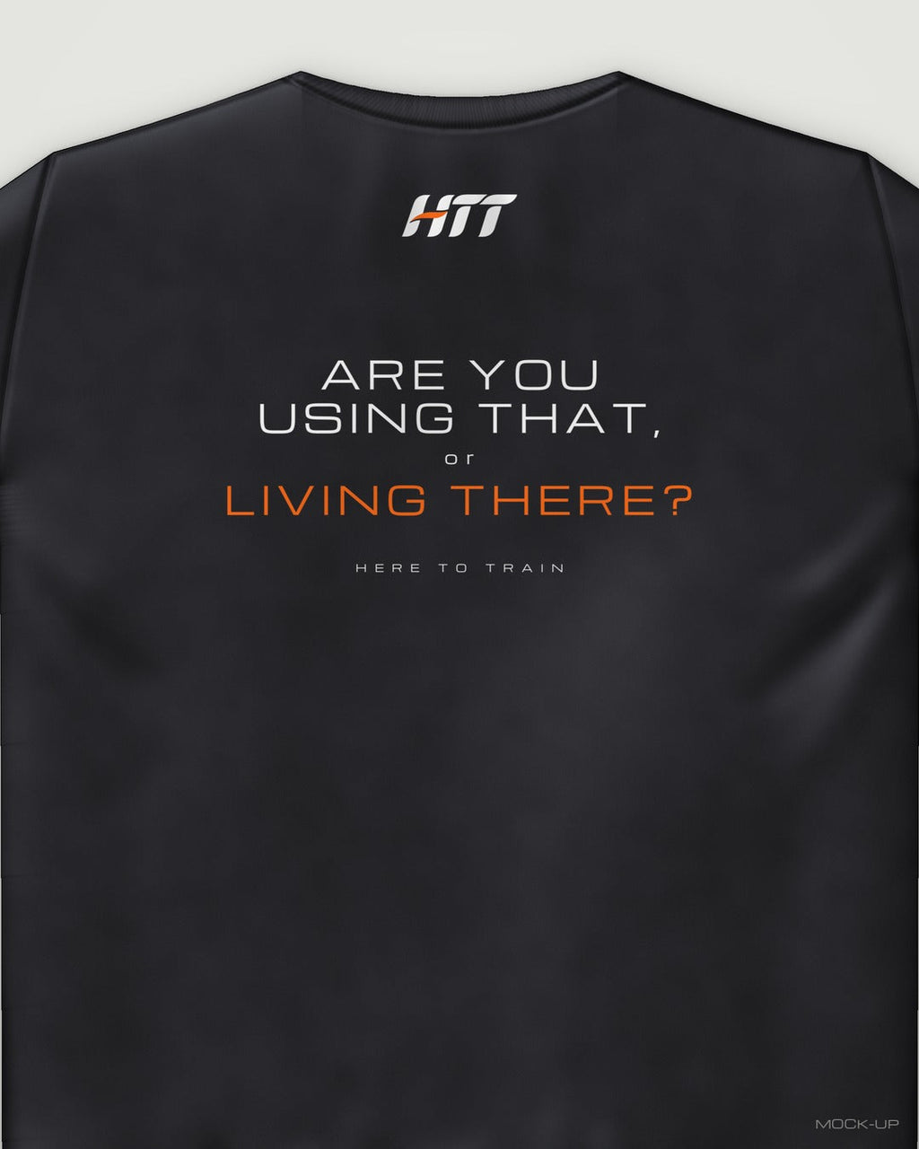 Back of a black HTT standard fit tee printed ARE YOU USING THAT, OR LIVING THERE? (portrait crop)