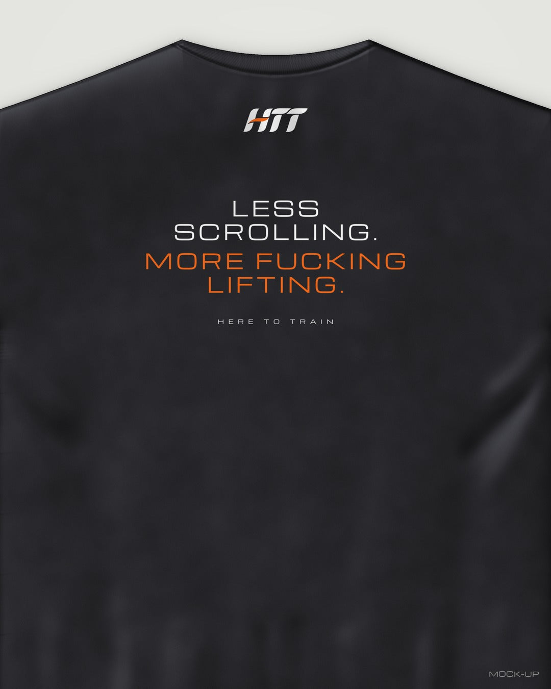 Back of a black HTT oversized tee printed LESS SCROLLING. MORE F***ING LIFTING. (portrait crop)