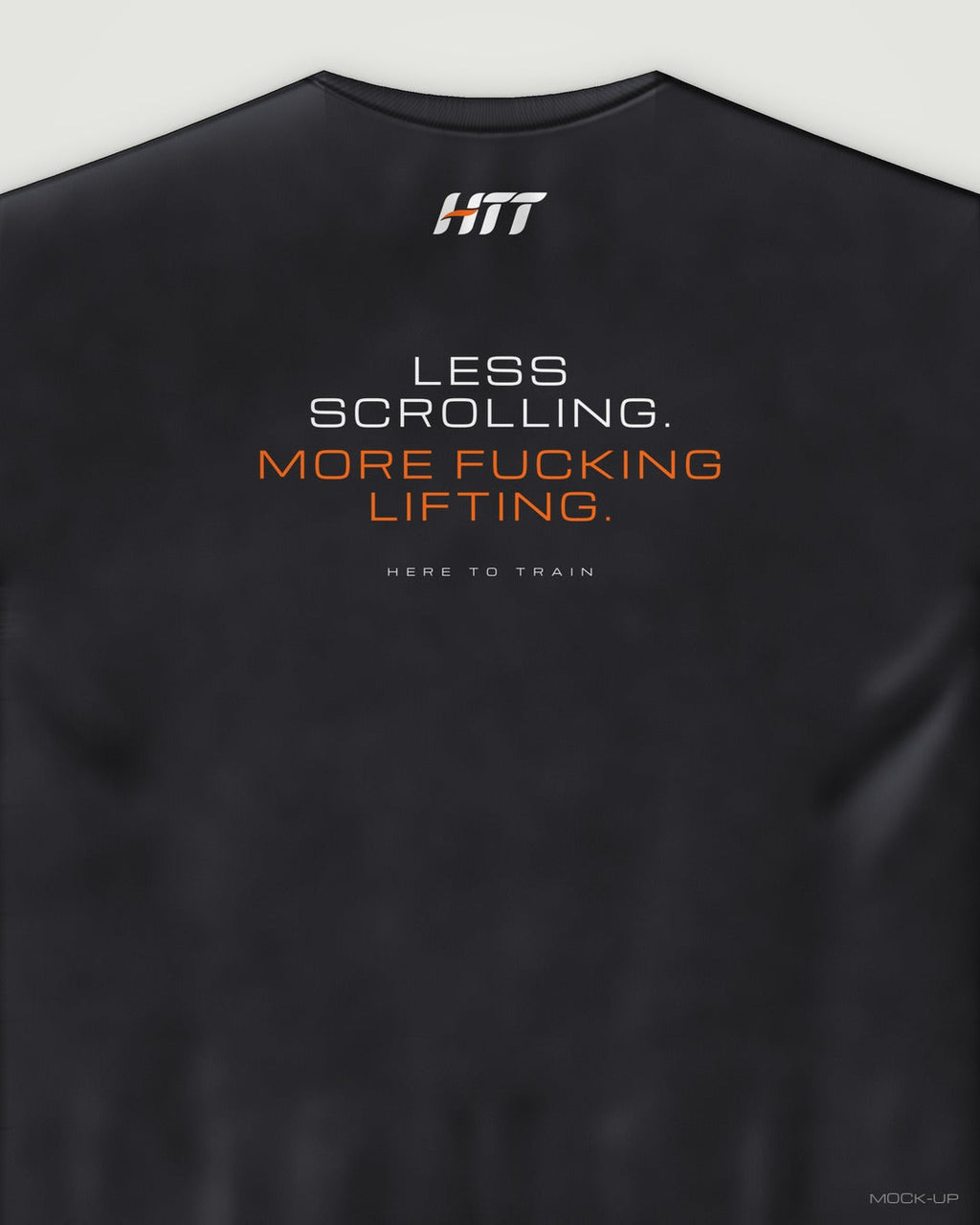 Back of a black HTT oversized tee printed LESS SCROLLING. MORE F***ING LIFTING. (portrait crop)