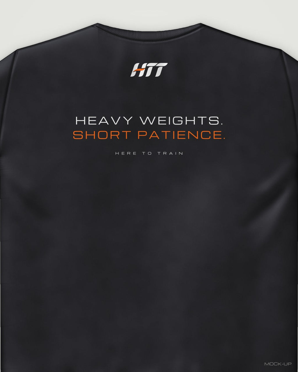 Back of a black HTT standard fit tee printed HEAVY WEIGHTS. SHORT PATIENCE. (portrait crop)