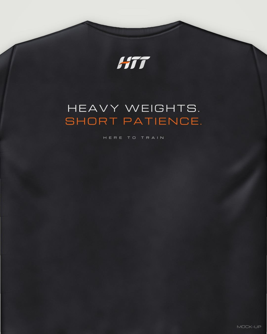 Back of a black HTT standard fit tee printed HEAVY WEIGHTS. SHORT PATIENCE. (portrait crop)